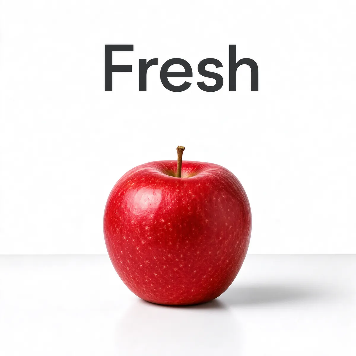 Fresh Red Apple on White Table