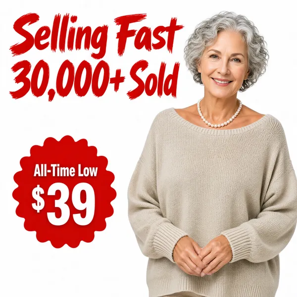 [Format]
Professional e-commerce product main image, square 1:1, direct-response apparel style on a minimal white ground with loud red sale type.

[Colors]
Background is a clean pure-white studio sweep with no props; the headline is vivid signal red (#e02020); the starburst price badge is the same bright red with white type; the sweater is a soft oatmeal-beige knit; skin tones are fair and warm under even studio light. No frame border.

[Layout]
The headline block fills the upper-left in two stacked lines; a scalloped red starburst sits mid-left carrying the price claim; the model stands centre-right in a relaxed half-length pose with comfortable white space around her; nothing else competes for attention.

[Subject]
A smiling white / Caucasian senior woman with short curly silver-grey hair, wearing a fine pearl necklace and a loose oatmeal-beige knit sweater with dropped shoulders and ribbed cuffs, standing straight with her hands gently clasped in front of her, soft even studio lighting and a gentle closed-lip smile.

[Headline]
Upper-left in giant bold red brush-style type: "Selling Fast"; beneath it a second red line "30,000+ Sold" with the number emphasized in heavier weight. Red scalloped starburst mid-left: "All-Time Low" in white above a huge white "39" with a small "$" prefix.

[Mood]
Cheerful, trustworthy bargain energy; minimal white ground letting the red sale typography pop.